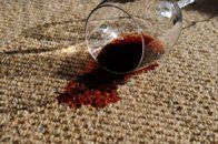 glass of red wine spilled on carpet