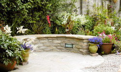curved garden seating made from stone
