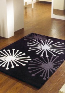 patterned rug on wooden floor